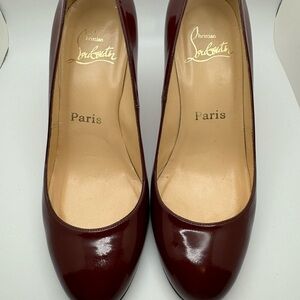 Christian Louboutin round toe pumps burgundy patent leather